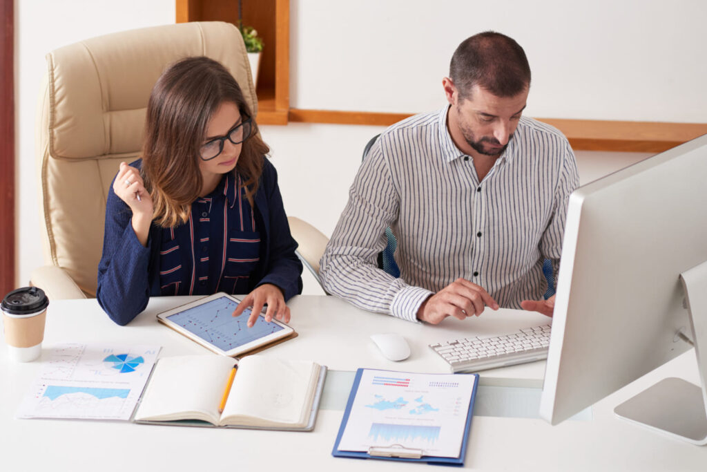 Accountant calculating taxes and reviewing financial data for personal and business tax preparation services in Hollywood, FL