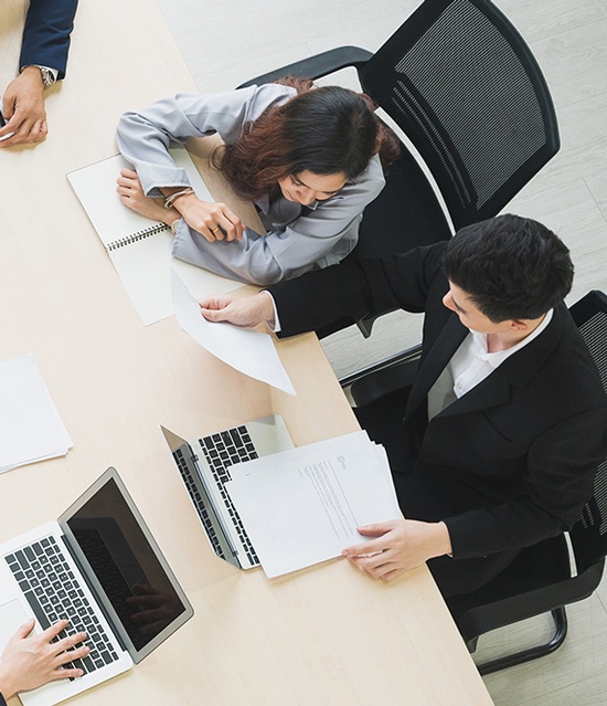 Business professionals analyzing financial data and planning bookkeeping services for small businesses in Hollywood, FL