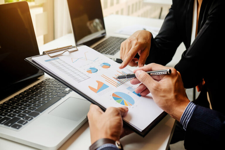Professionals reviewing financial charts and performance for business financial management services in Hollywood, FL