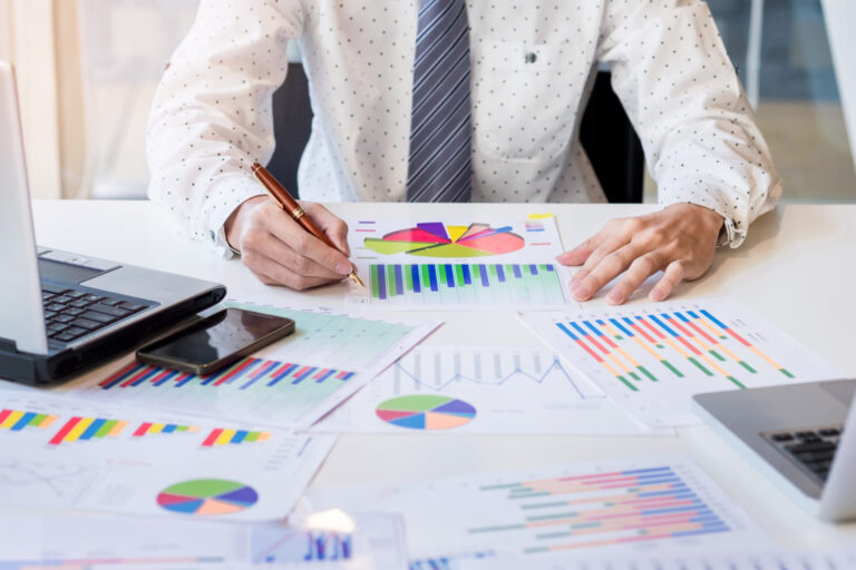 Financial expert analyzing reports and charts for tax planning services and tax strategies in Hollywood, FL