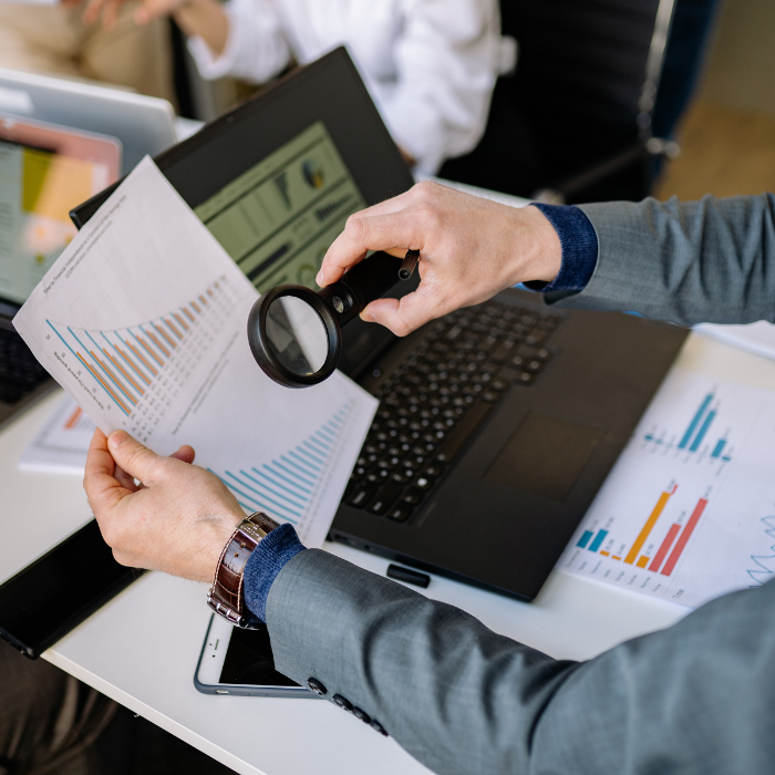 Accountant reviewing financial statements and business data for small business tax preparation services in Hollywood, FL