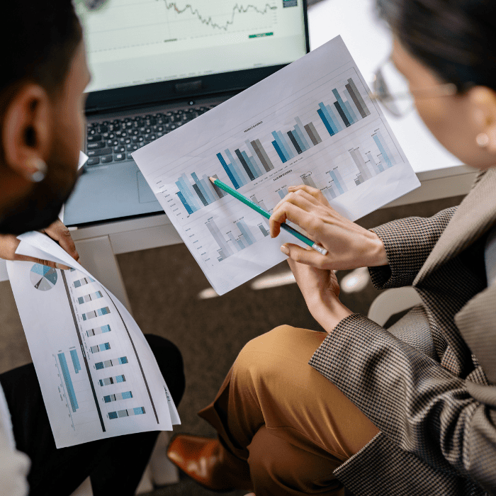 Business professionals reviewing documents and analyzing data for financial reporting and accounting services in Hollywood, FL