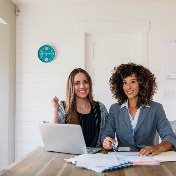 Business consultants reviewing financial data and planning budgets for business financial management services in Hollywood, FL